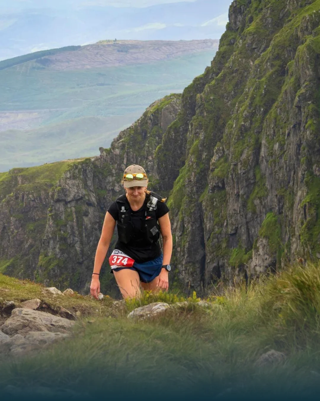 Kaylee climbing a mountain, taking on GB Ultra Wales 50