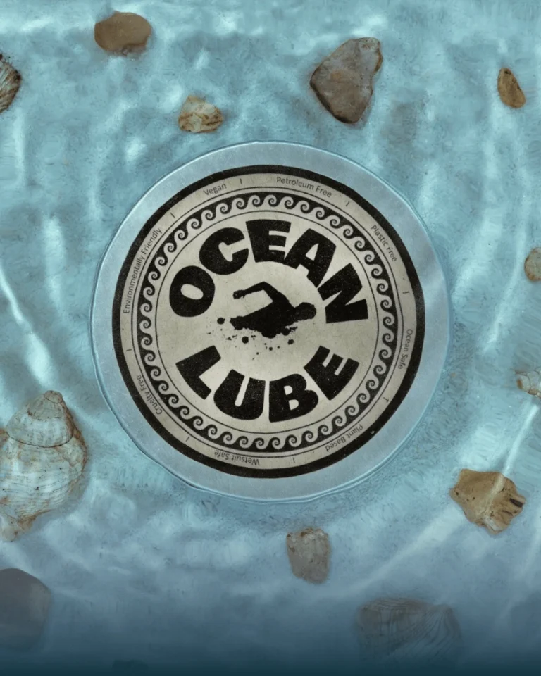 Ocean Lube anti-chafing cream tin surrounded by shells