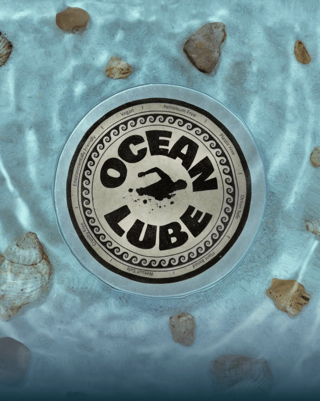 Ocean Lube anti-chafing cream tin surrounded by shells