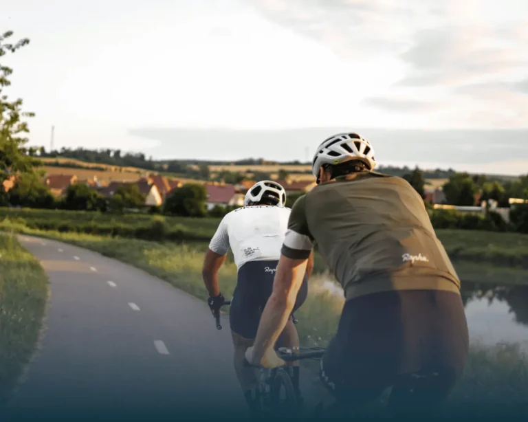 Two people out road cycling in the countryside